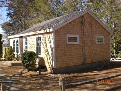 68 Old Farm Road Centerville, MA 02632 - Photo 4 of 7 a view of a house with a yard