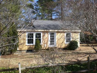 68 Old Farm Road Centerville, MA 02632 - Photo 6 of 7 a front view of a house with garden