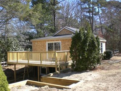 68 Old Farm Road Centerville, MA 02632 - Photo 7 of 7 a front view of a house with a balcony