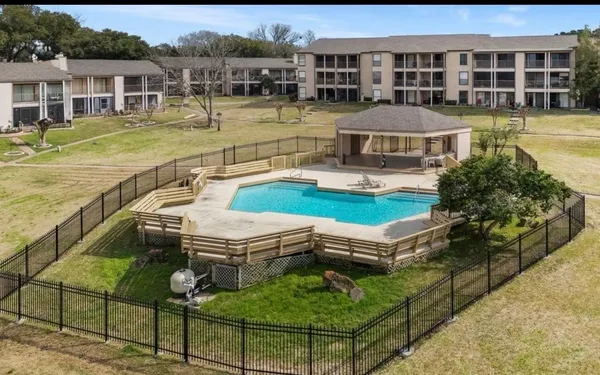 a aerial view of a house with swimming pool outdoor seating and yard view