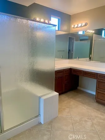 a bathroom with a sink and mirror