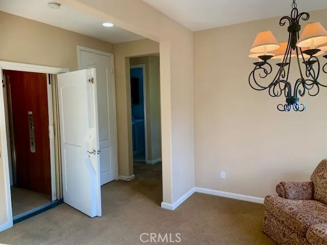 a view of entryway with furniture and wall paintings