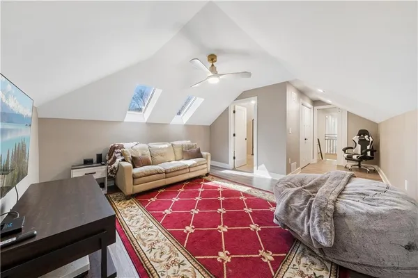 a bedroom with a bed and a mirror