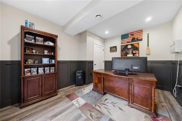 a room with furniture wooden floor and window