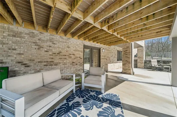 a outdoor living space with patio furniture and wooden floor