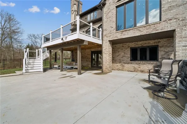 a building with table and chairs in front of it