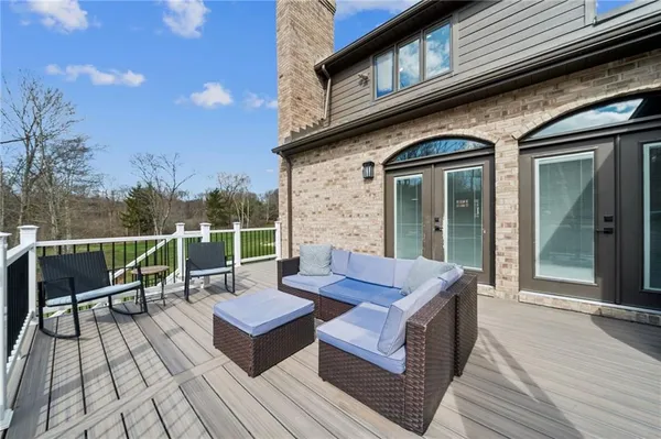 a view of a dinning tables and chairs in the balcony