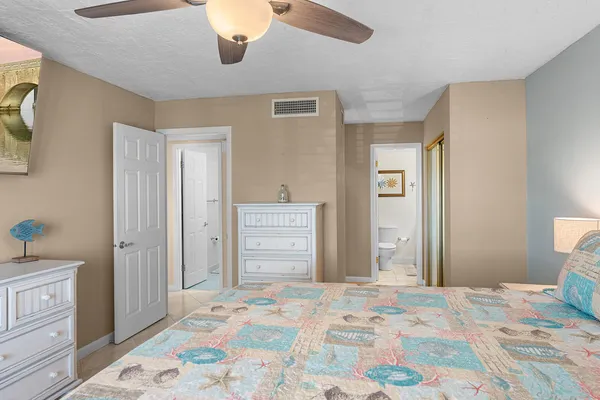 a bedroom with a bed and a cabinets