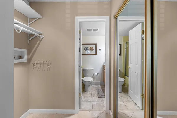 a bathroom with a granite countertop mirror