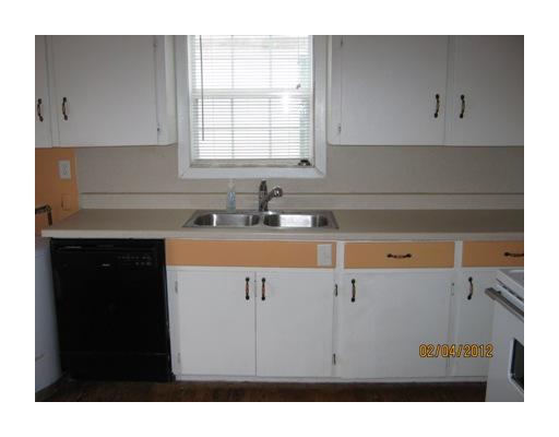 3461 Lawnview Street Corpus Christi, TX 78411 - Photo 3 of 10 a kitchen with a sink dishwasher and cabinets
