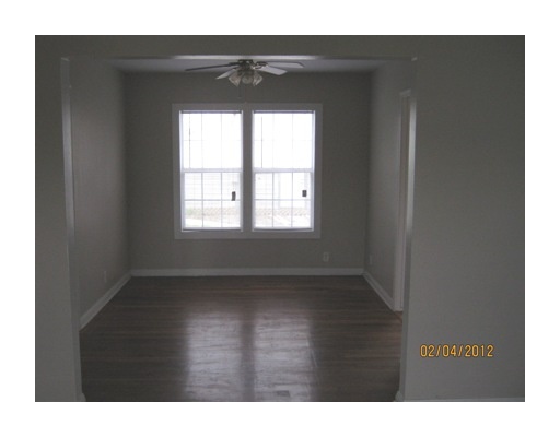 3461 Lawnview Street Corpus Christi, TX 78411 - Photo 5 of 10 a view of an empty room with wooden floor and a window