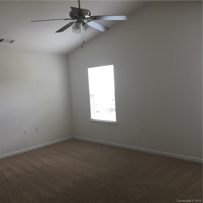 3018 Arthur Road, Unit 165 Indian Land, SC 29707 - Photo 14 of 19 an empty room with a window and a fan