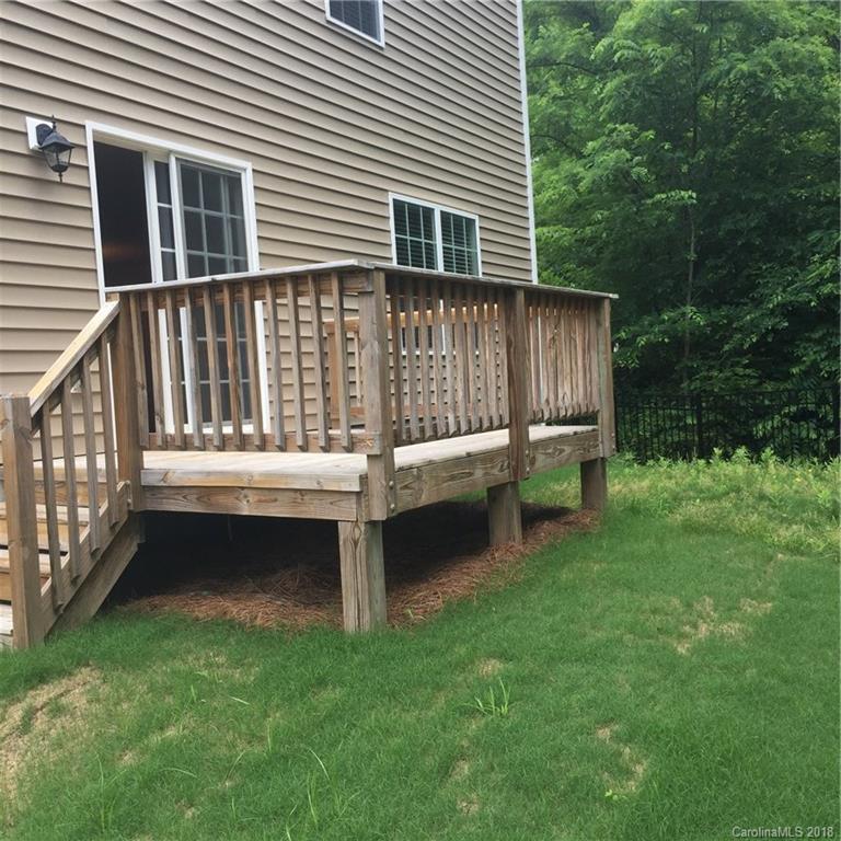 3018 Arthur Road, Unit 165 Indian Land, SC 29707 - Photo 8 of 19 a view of a wooden deck and a yard