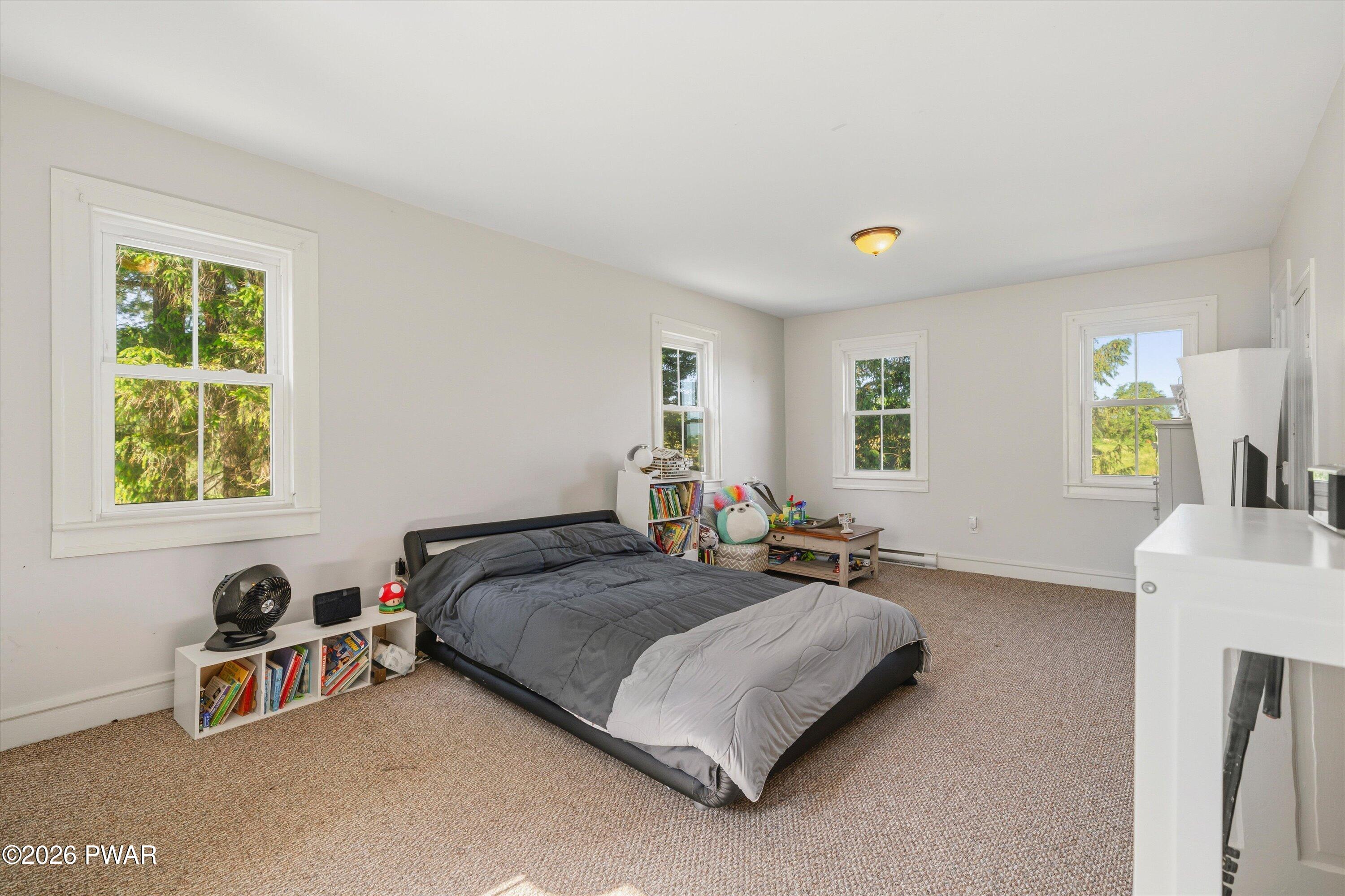 127 Valleyview Road Greentown, PA 18426 - Photo 42 of 66 a bedroom with a bed and a window