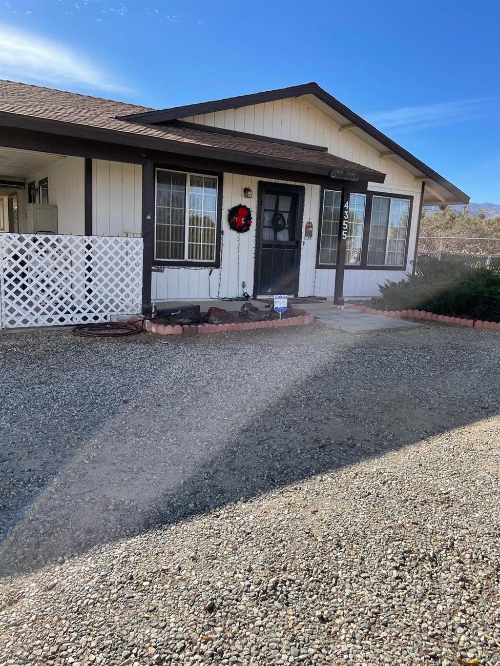 4355 Nielson Road, Unit 158 Phelan, CA 92371 - Photo 1 of 1 a front view of a house with parking