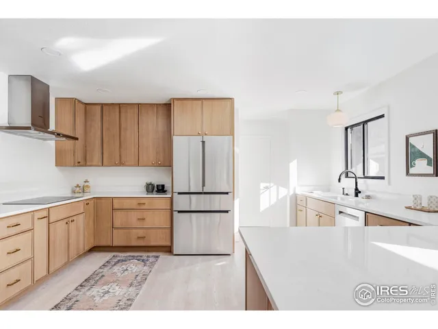 a kitchen with cabinets and appliances