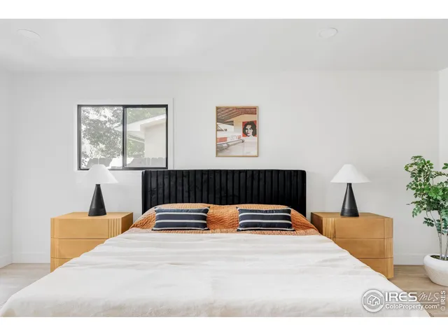 a living room with a rug and a lamp