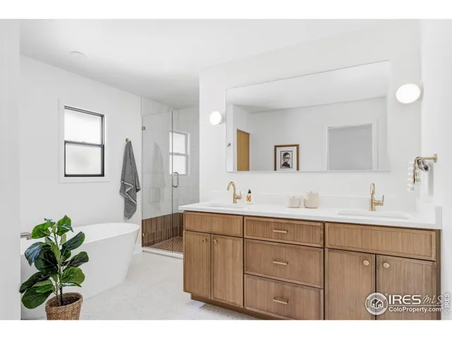 a spacious bathroom with a sink and a mirror