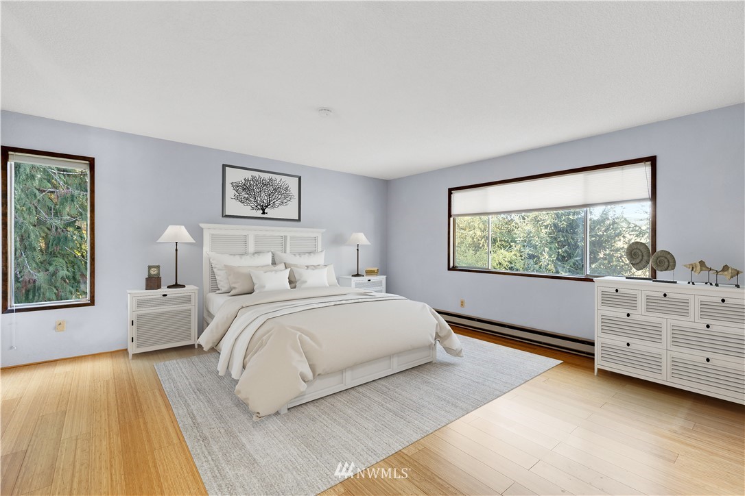 1381 Wynoochee Valley Road Montesano, WA 98563 - Photo 14 of 40 a spacious bedroom with a bed and a window