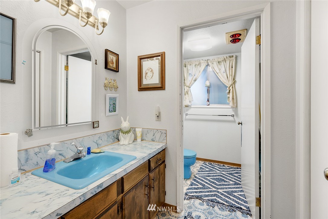 1381 Wynoochee Valley Road Montesano, WA 98563 - Photo 19 of 40 a bathroom with a sink and a mirror