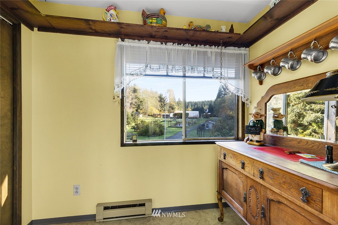 1381 Wynoochee Valley Road Montesano, WA 98563 - Photo 9 of 40 a view of a room with wooden floor and iron stairs