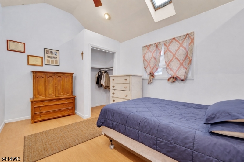 627 East Vail Road Landing, NJ 07850 - Photo 13 of 26 a bedroom with a bed and a painting on the wall