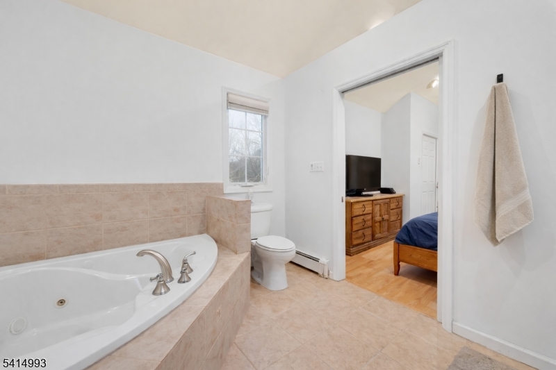 627 East Vail Road Landing, NJ 07850 - Photo 14 of 26 a bathroom with a bathtub sink and toilet