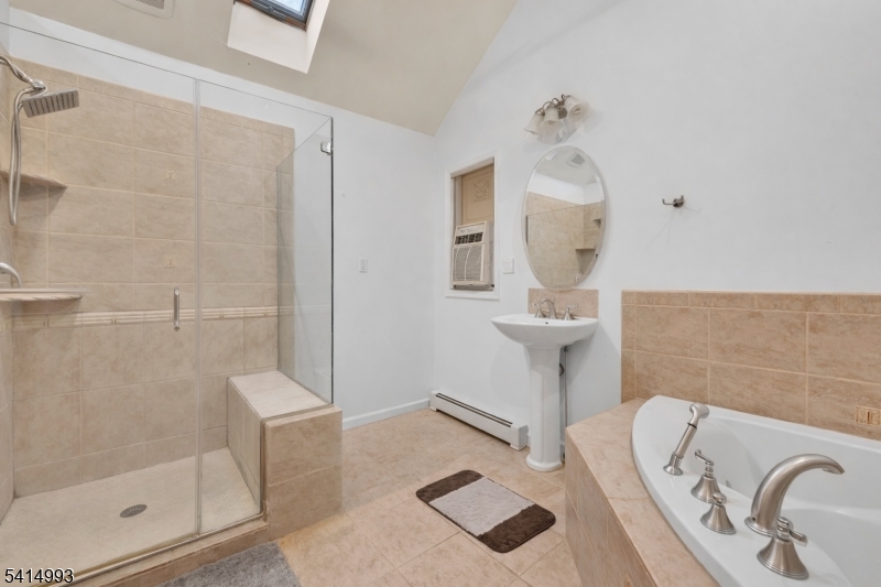 627 East Vail Road Landing, NJ 07850 - Photo 15 of 26 a bathroom with a sink a toilet and shower