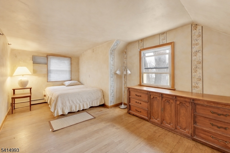 627 East Vail Road Landing, NJ 07850 - Photo 16 of 26 a spacious bedroom with a large bed and a window