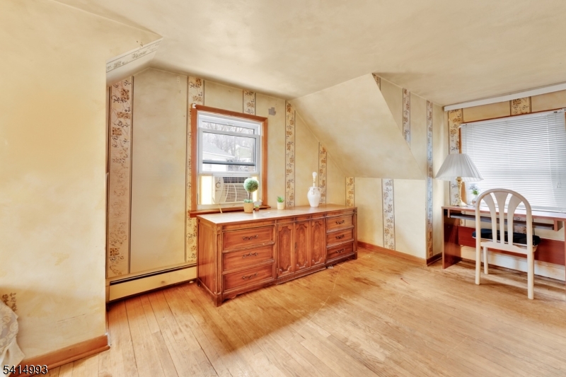 627 East Vail Road Landing, NJ 07850 - Photo 17 of 26 a bed room with a bed and a chair