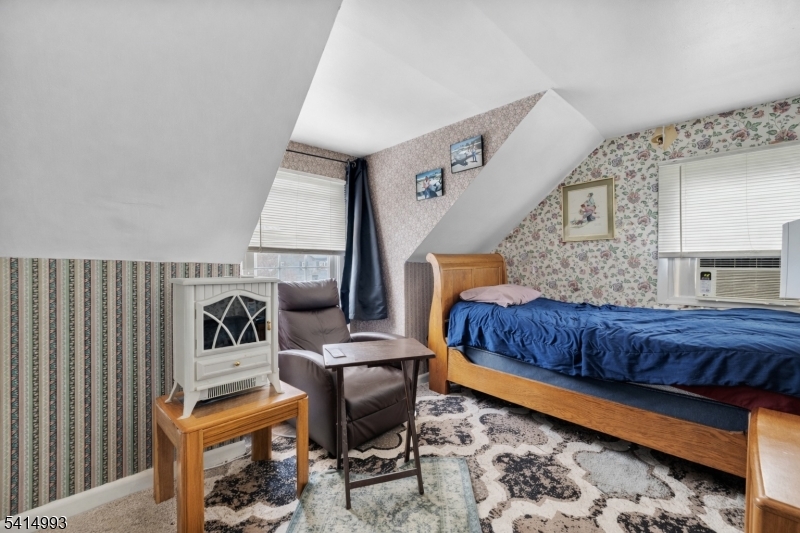 627 East Vail Road Landing, NJ 07850 - Photo 19 of 26 a bedroom with furniture and a window