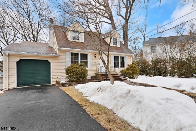 627 East Vail Road Landing, NJ 07850 - Photo 2 of 26 a view of a house with a yard covered with snow in front of house