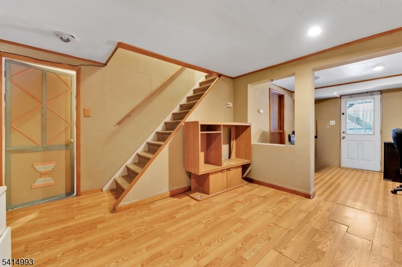 627 East Vail Road Landing, NJ 07850 - Photo 21 of 26 a view of a livingroom with wooden floor and stairs