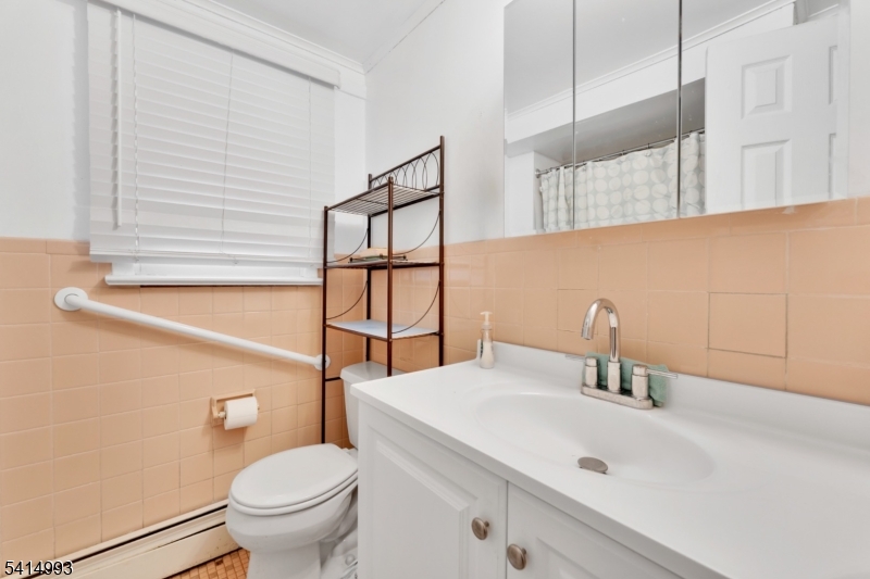627 East Vail Road Landing, NJ 07850 - Photo 23 of 26 a bathroom with a sink and a toilet