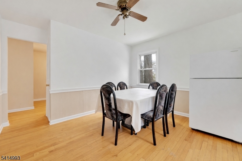 627 East Vail Road Landing, NJ 07850 - Photo 5 of 26 a view of a dining room with furniture and wooden floor
