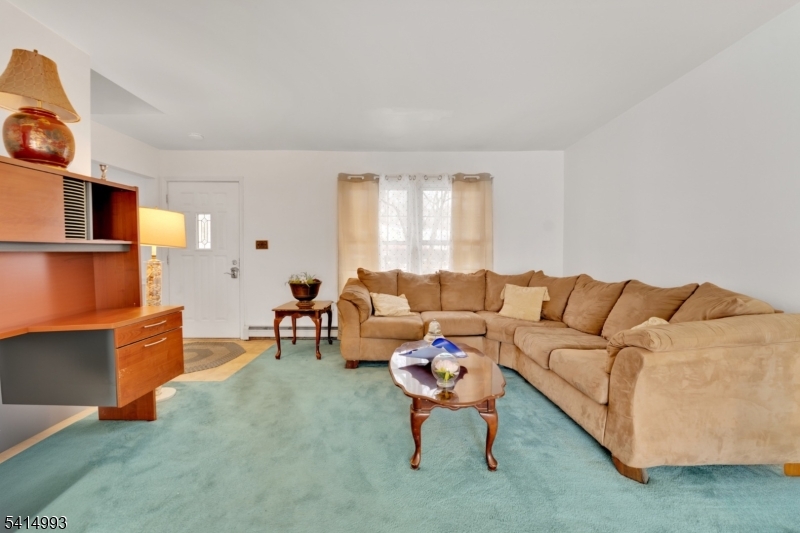 627 East Vail Road Landing, NJ 07850 - Photo 6 of 26 a living room with furniture and a flat screen tv