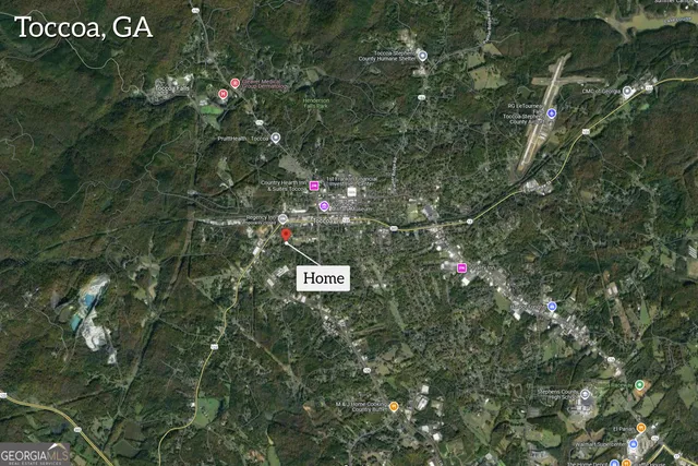 a view of a house with a yard porch and sitting area