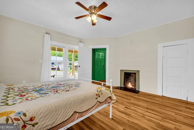 a bedroom with a bed and a fireplace