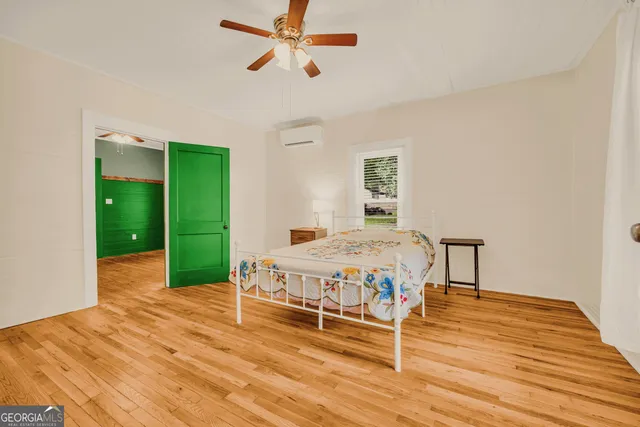 a bedroom with a bed and a table