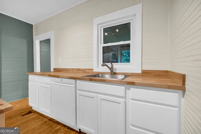 a bathroom with a sink and mirror