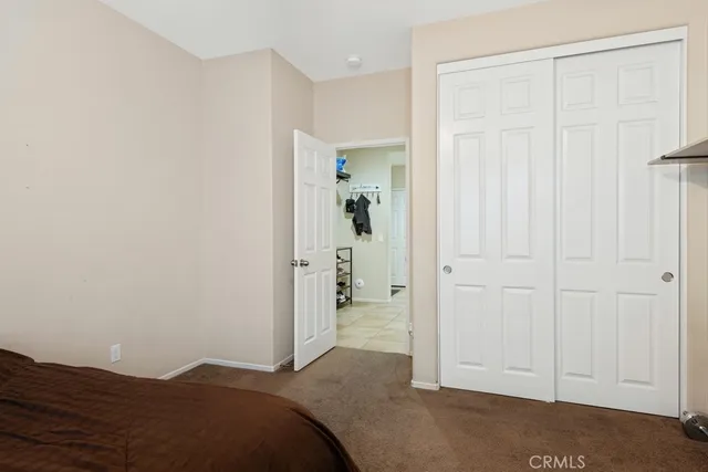 a view of a bedroom with closet