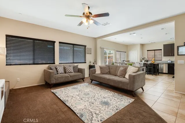 a living room with furniture and a rug