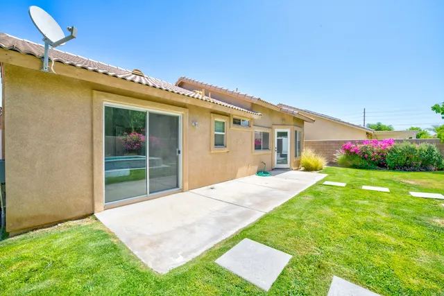 a view of an house with backyard porch and entertaining space