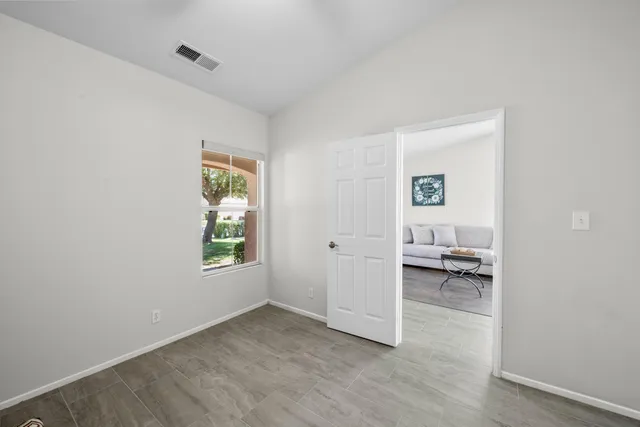 a view of room with a chair and a window