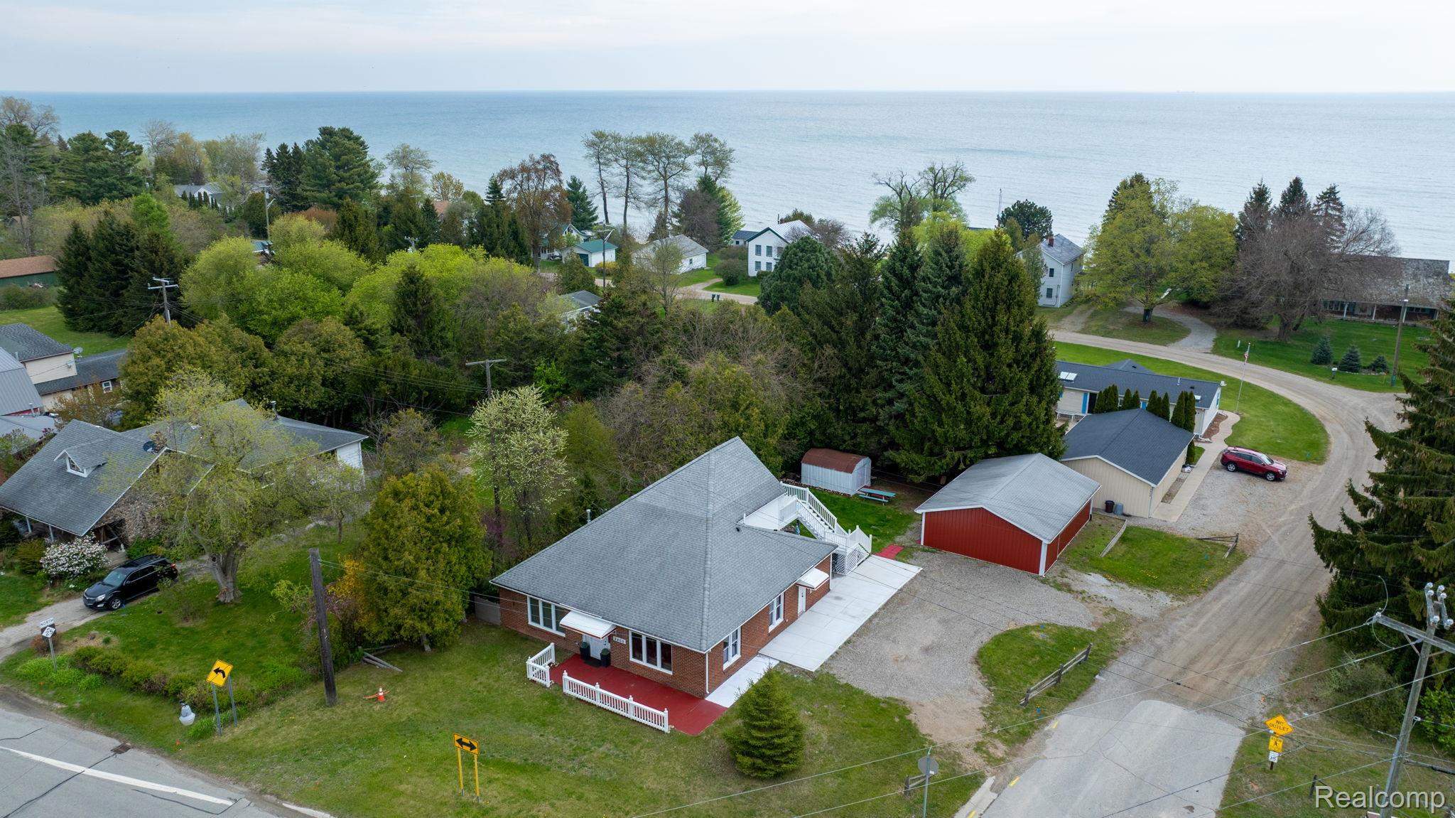 2400 North Lakeshore Road Carsonville, MI 48419 - Photo 31 of 33 Aerial perspective of suburban area featuring a large body of water