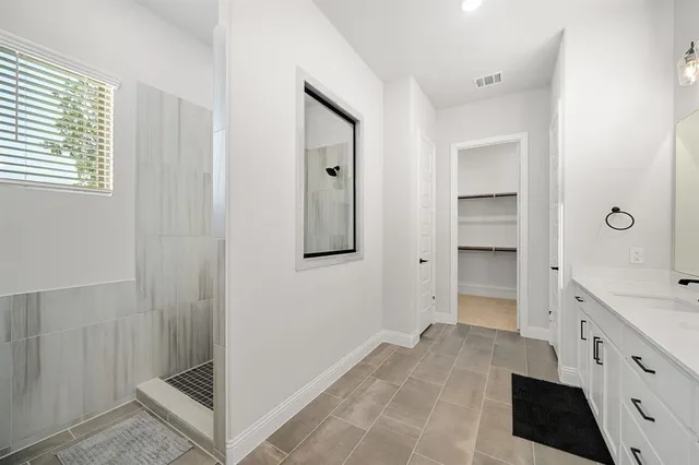 a view of hallway with stairs and wooden floor