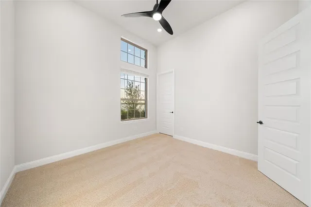 a bathroom with a sink a toilet a mirror and shower