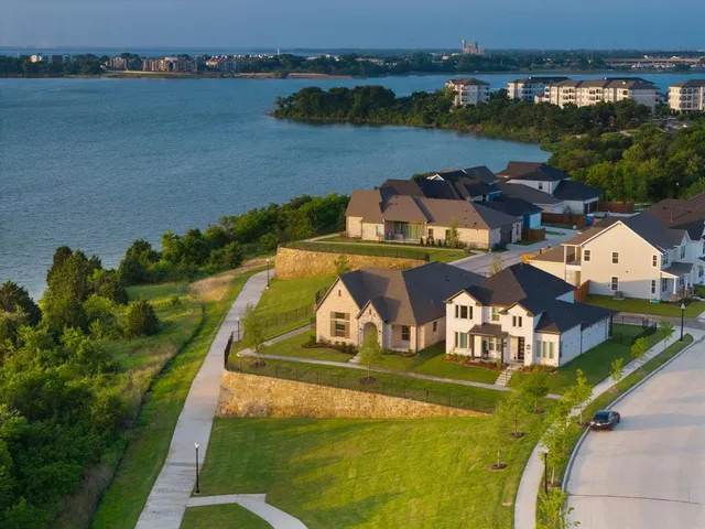 an aerial view of a house with outdoor space swimming pool and lake view