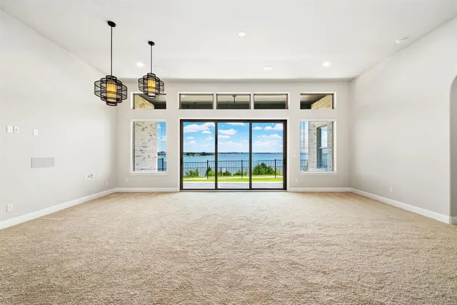 a large kitchen with kitchen island a sink stainless steel appliances and cabinets