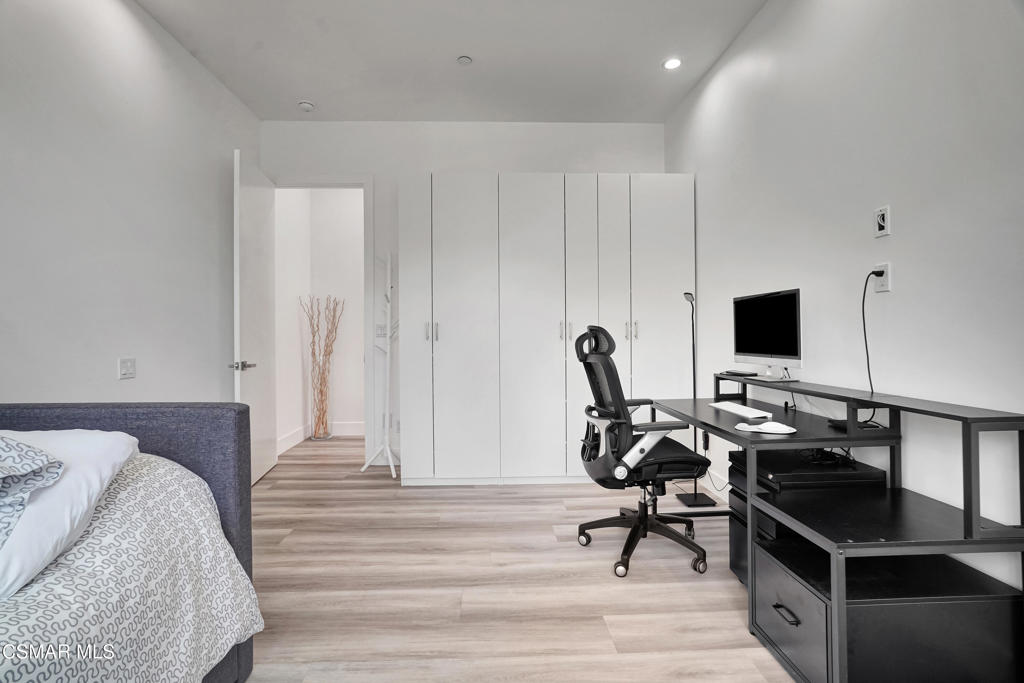 990 Alta Vista Road Simi Valley, CA 93063 - Photo 22 of 36 a view of a workspace with furniture and wooden floor